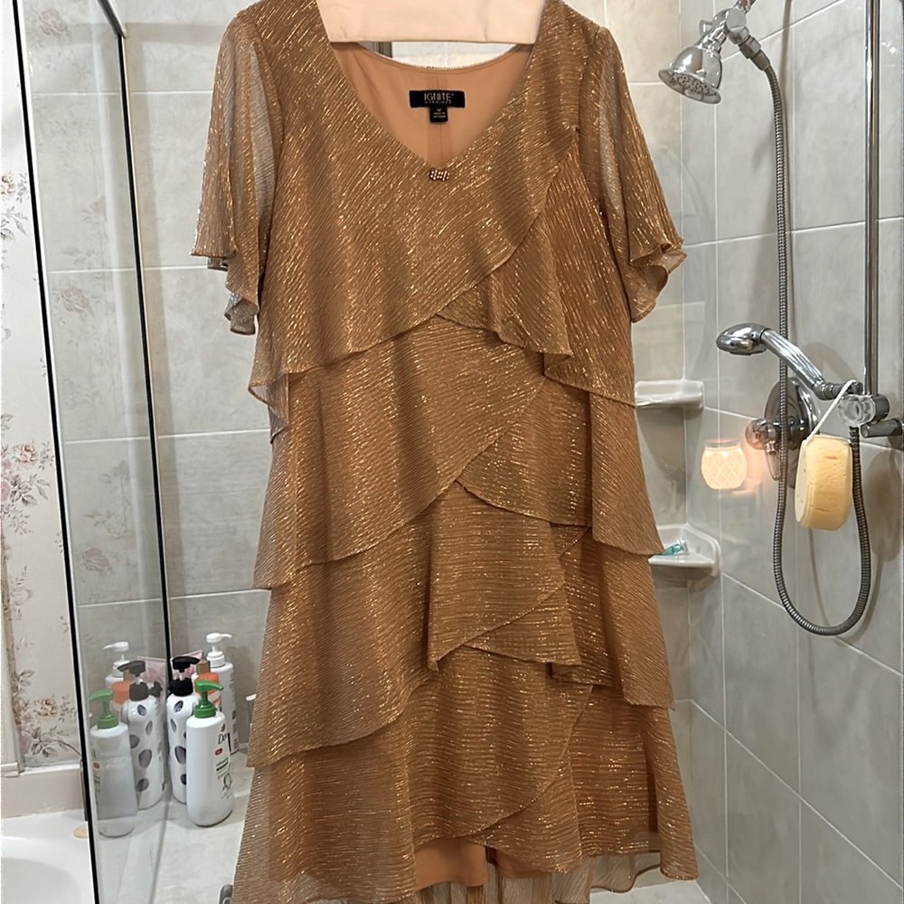 Light gold tiered dress. Stretchy fabric. Worn once!! Great for wedding or party
